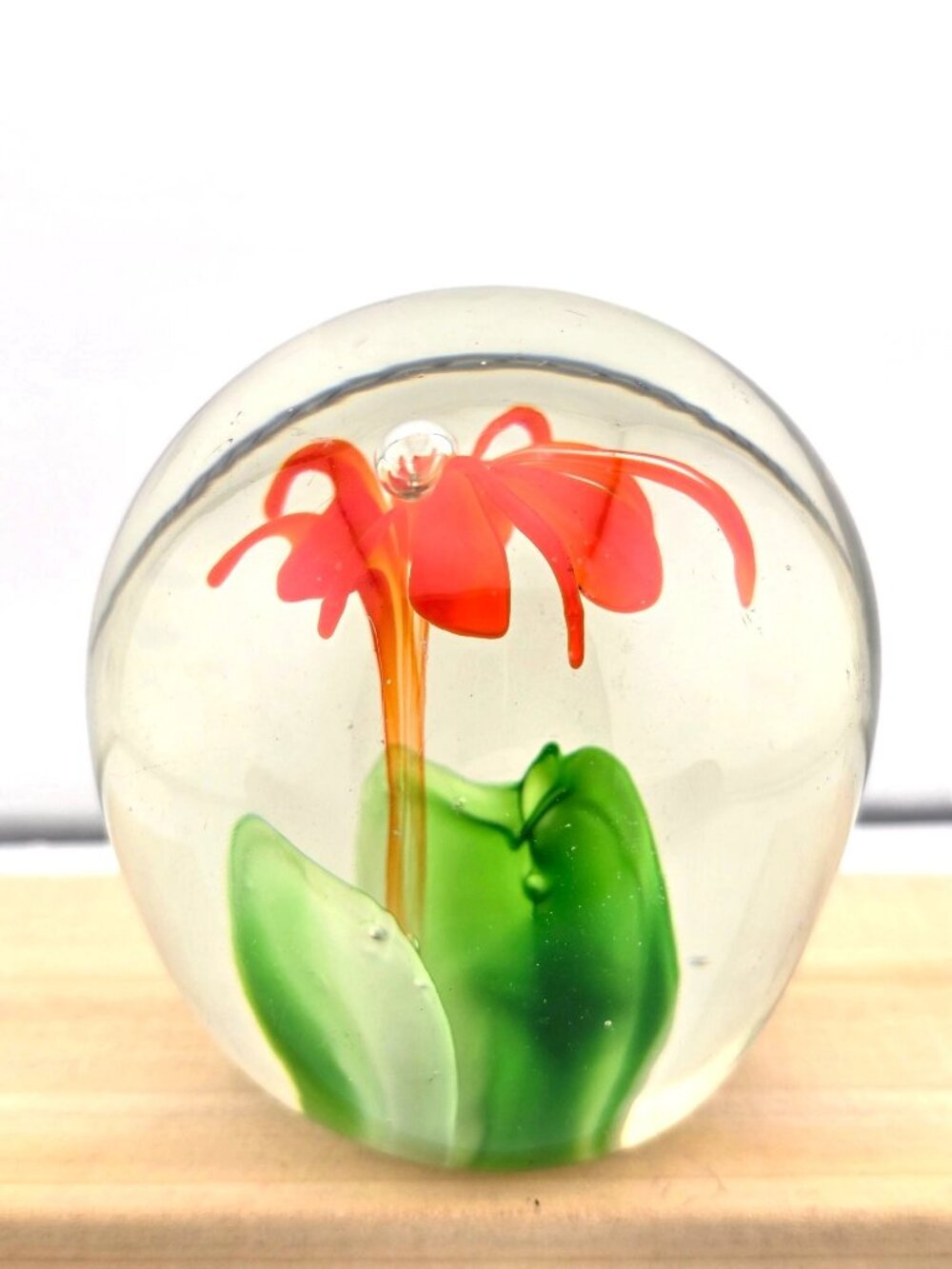 Handcrafted Clear Glass Paperweight With Orange Flower Design & Green Leaves